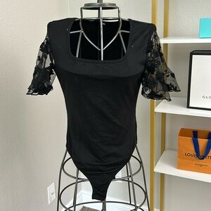 Black bodysuit with floral sleeves